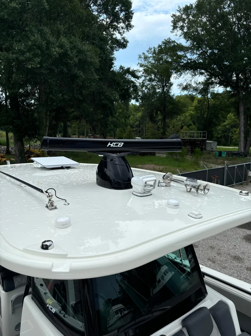 Slide: The Image of Control panel of 2017 HCB Speciale boat with switches and throttle. - 28