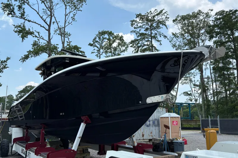 Slide: The Image of 2017 HCB Speciale boat docked, featuring sleek design and powerful engines. - 3