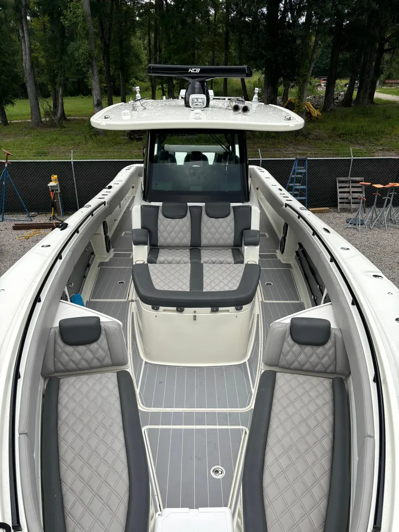 Slide: The Image of 2017 HCB Speciale boat roof with radar and antennas, surrounded by trees. - 33