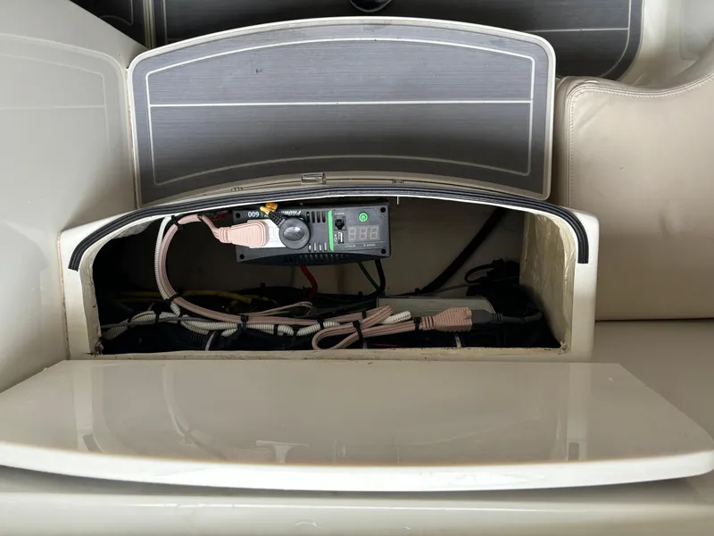 Slide: The Image of 2017 HCB Speciale boat interior with rod holders and cushioned seating. - 43