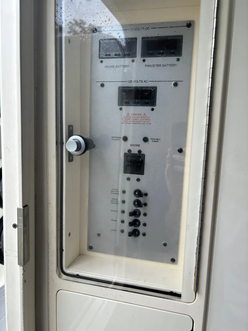 Slide: The Image of 2017 HCB Speciale boat interior with compact bathroom, featuring a toilet, sink, and mirror. - 51