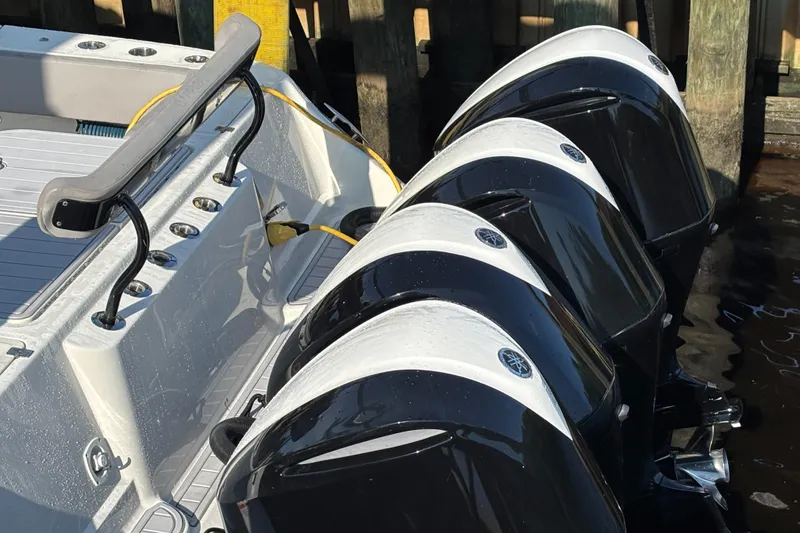 Slide: The Image of 2017 HCB Speciale boat interior with luxurious seating at a marina dock. - 6