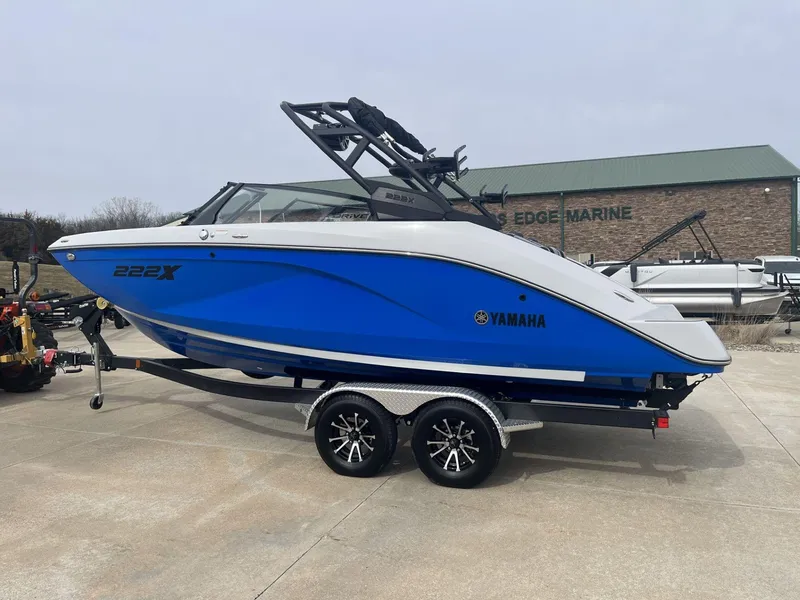 Slide: The Image of 2024 Yamaha Boats 222XD in blue on trailer at dealership. - 3