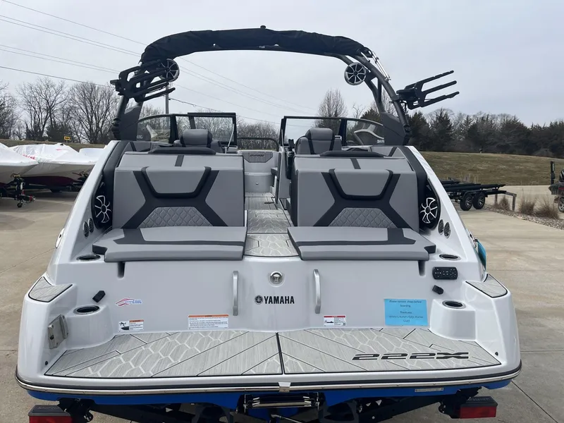 Slide: The Image of 2024 Yamaha Boats 222XD, sleek design, spacious seating, modern features, docked outdoors. - 5