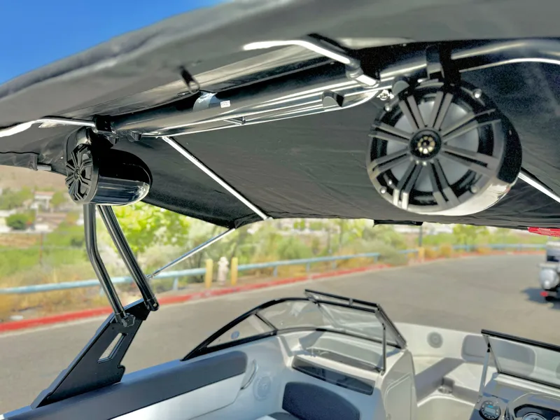 Slide: The Image of 2021 Bayliner VR5 Bowrider I/O with speakers under canopy. - 11