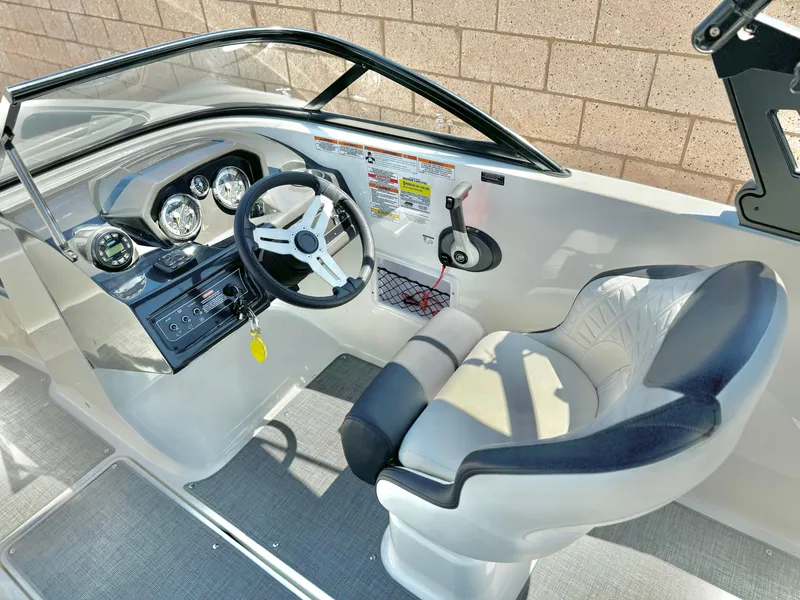 Slide: The Image of 2021 Bayliner VR5 Bowrider I/O cockpit with steering wheel and comfortable seating. - 15
