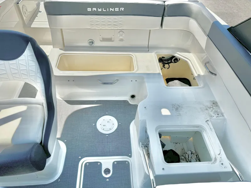 Slide: The Image of 2021 Bayliner VR5 Bowrider I/O interior with storage compartments and seating. - 19
