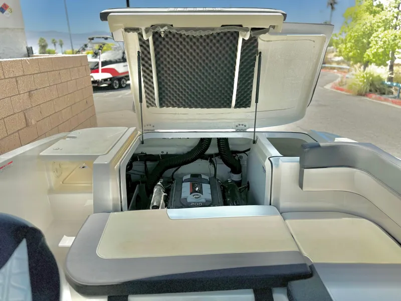 Slide: The Image of 2021 Bayliner VR5 Bowrider I/O engine compartment with open hatch, showcasing interior details. - 20