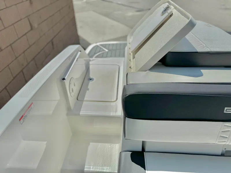 Slide: The Image of 2021 Bayliner VR5 Bowrider I/O boat interior with seating and storage compartments. - 21