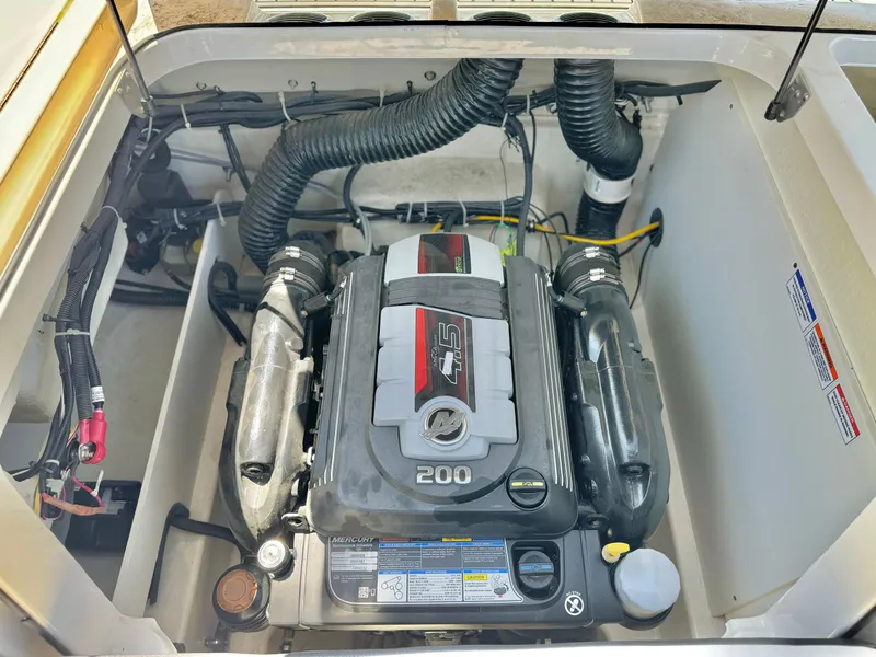 Slide: The Image of 2021 Bayliner VR5 Bowrider I/O engine compartment with 200 HP motor. - 22