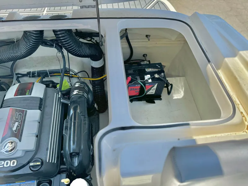 Slide: The Image of 2021 Bayliner VR5 Bowrider I/O engine and battery compartment view. - 23