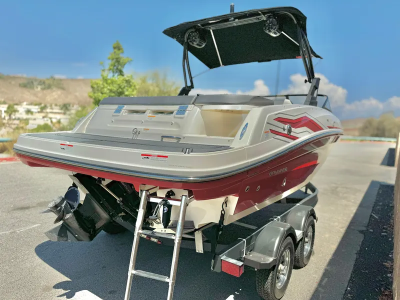 Slide: The Image of 2021 Bayliner VR5 Bowrider I/O on trailer, rear view with ladder and canopy. - 3