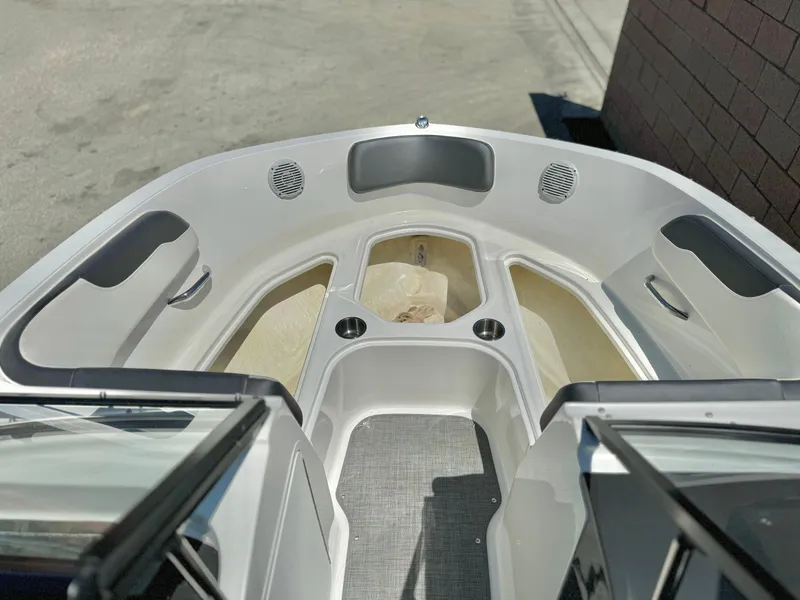Slide: The Image of 2021 Bayliner VR5 Bowrider I/O boat interior with spacious seating and cup holders. - 9