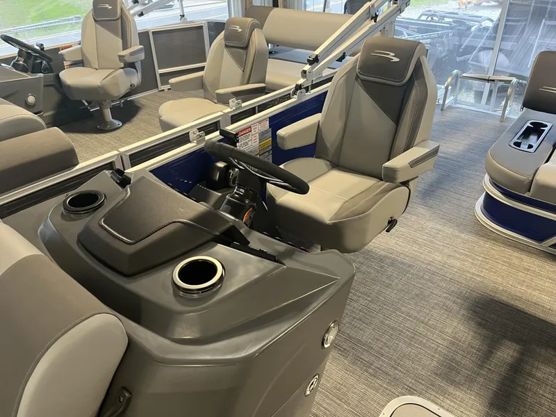 Slide: The Image of 2024 Bennington 20 SVSB-SPS boat interior with modern seating and steering console. - 2