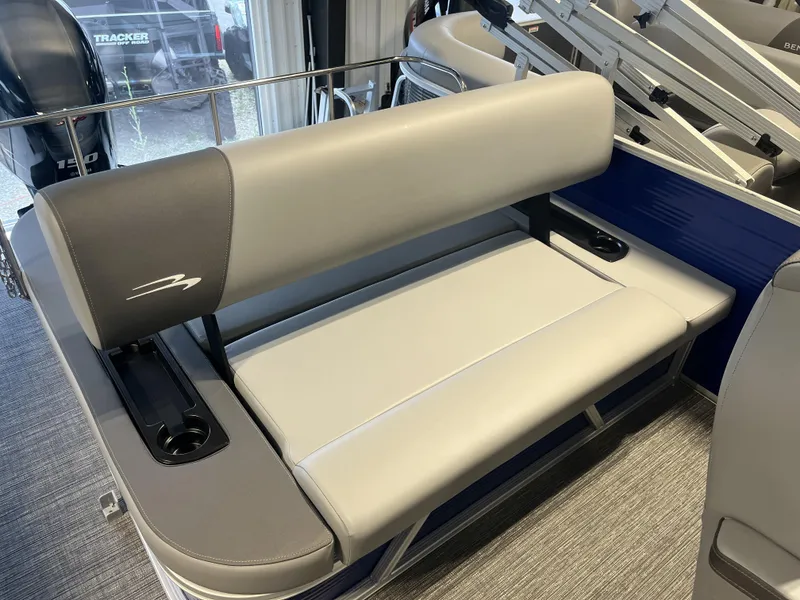 Slide: The Image of 2024 Bennington 20 SVSB-SPS boat interior with gray seating and cup holders. - 3
