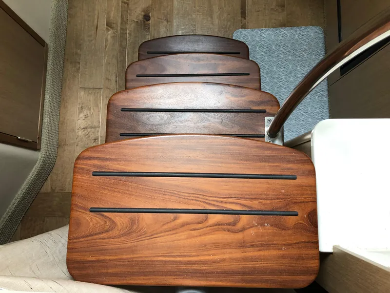 Slide: The Image of Wooden steps inside 2018 Sea Ray 350 Sundancer Coupe yacht, featuring sleek design and craftsmanship. - 13