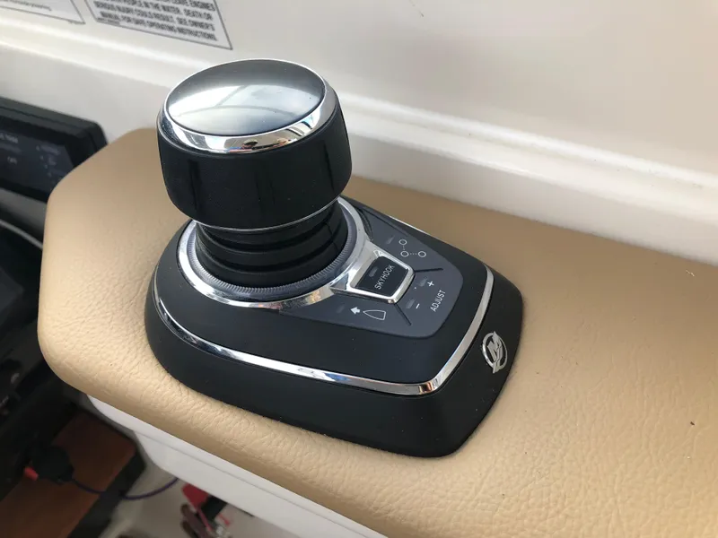 Slide: The Image of Joystick control on 2018 Sea Ray 350 Sundancer Coupe boat dashboard. - 8