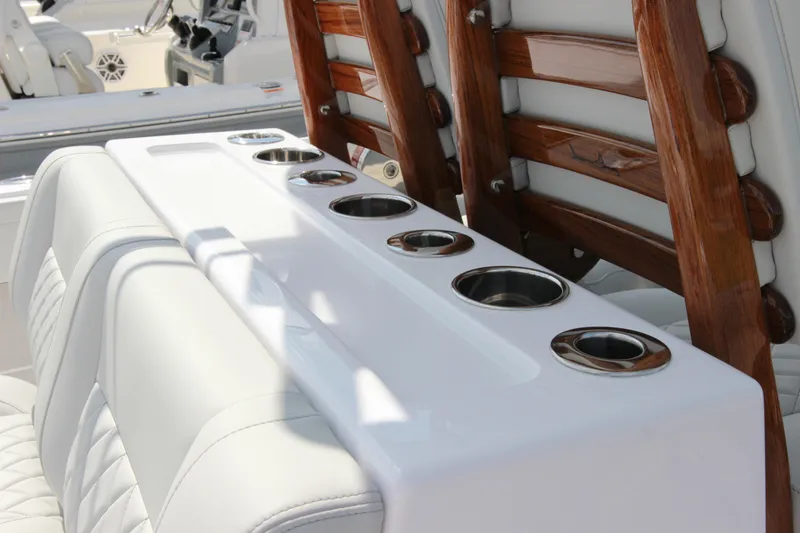 Slide: The Image of Luxury seating and cup holders on 2025 Jupiter 380LS boat. - 12