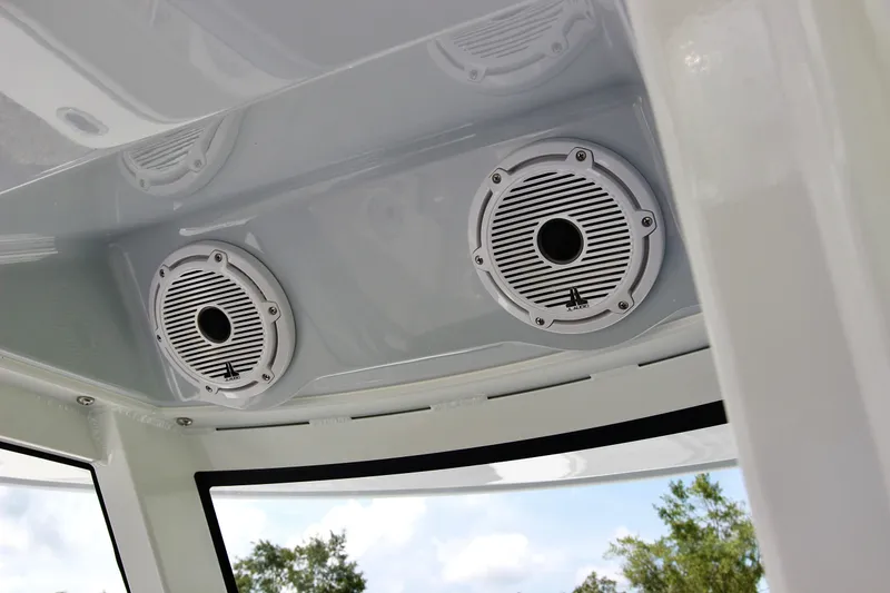 Slide: The Image of Speakers on the ceiling of a 2025 Jupiter 380LS boat, with a clear sky view. - 17