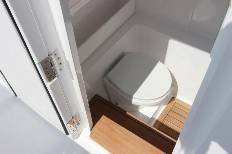 Slide: The Image of Compact bathroom with wooden flooring in 2025 Jupiter 380LS boat. - 20