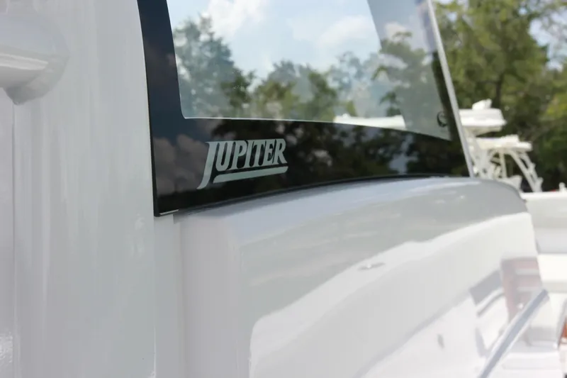 Slide: The Image of Close-up of 2025 Jupiter 380LS boat with logo and sleek design. - 21