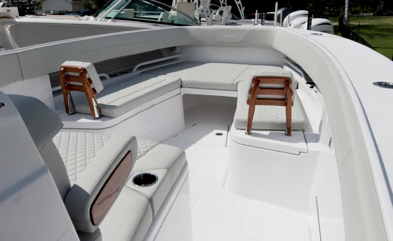 Slide: The Image of Luxurious seating area on the 2025 Jupiter 380LS boat, featuring elegant design and comfort. - 22