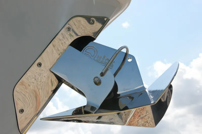 Slide: The Image of Shiny anchor on Jupiter 380LS boat, 2025 model, against a cloudy sky. - 4