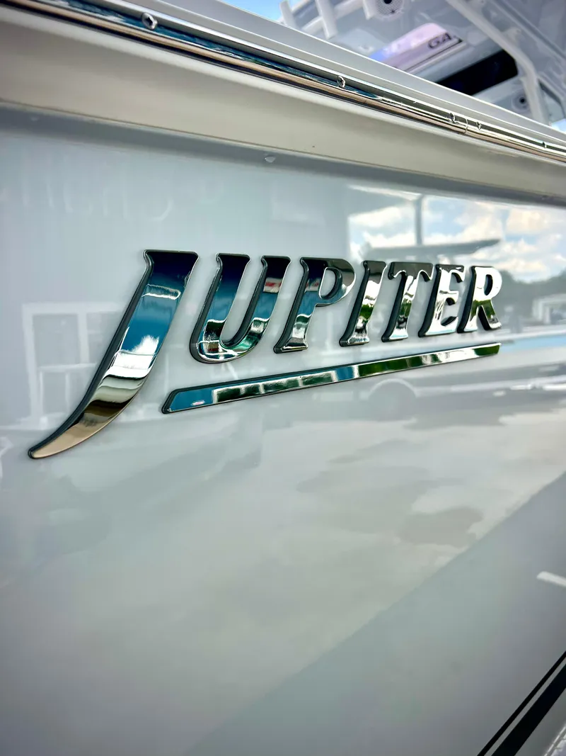 Slide: The Image of 2025 Jupiter 380LS boat logo on sleek white surface. - 5