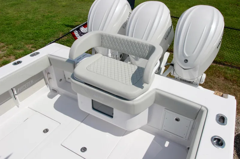 Slide: The Image of 2025 Jupiter 380LS boat with triple outboard engines and cushioned seating. - 6