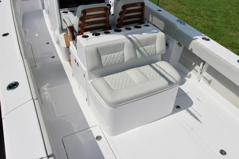 Slide: The Image of 2025 Jupiter 380LS boat interior with white cushioned seating and sleek design. - 8