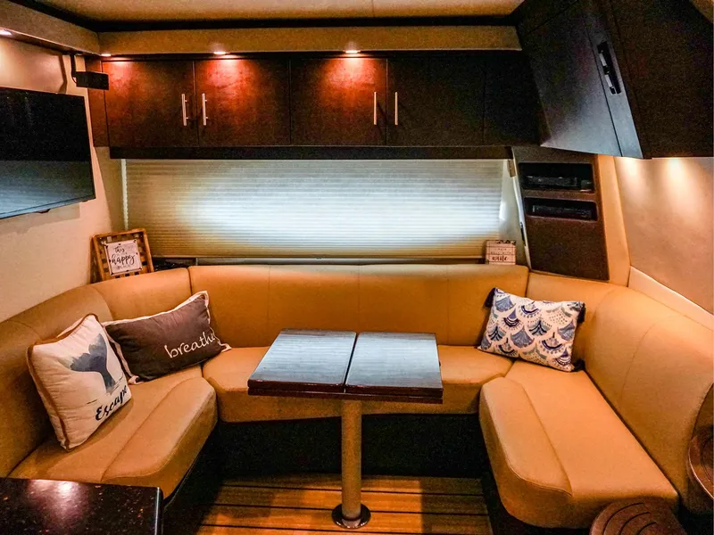 Slide: The Image of Luxurious interior of 2015 Regal 42 Sport Coupe with cozy seating and elegant decor. - 13