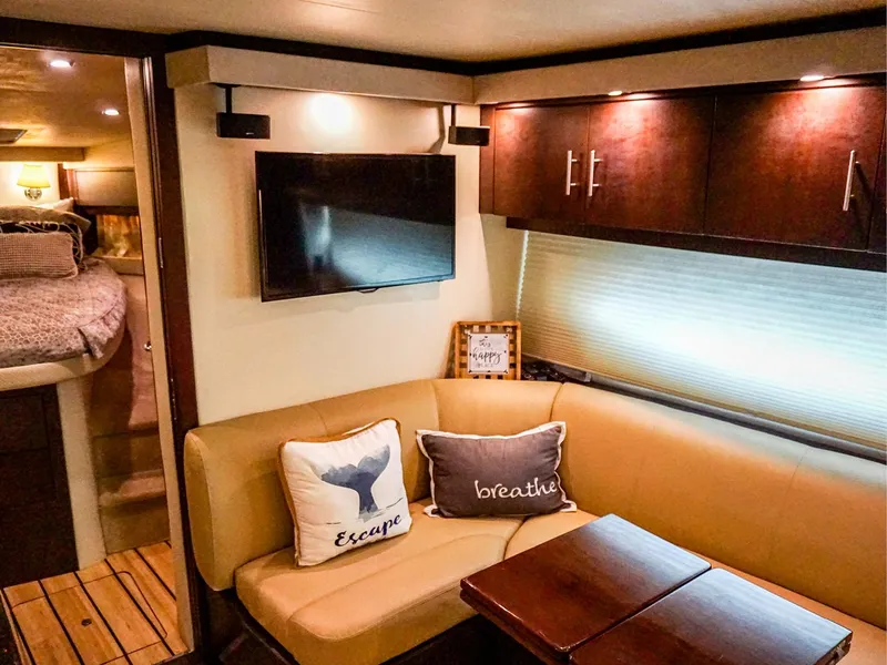 Slide: The Image of Luxurious interior of 2015 Regal 42 Sport Coupe with cozy seating and modern decor. - 14