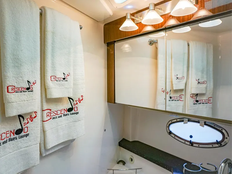 Slide: The Image of Luxurious bathroom in 2015 Regal 42 Sport Coupe with elegant towels and lighting. - 17