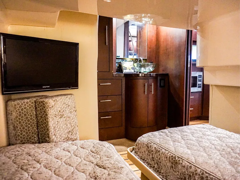 Slide: The Image of Interior of 2015 Regal 42 Sport Coupe with twin beds and modern amenities. - 19