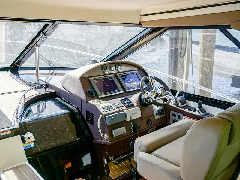 Slide: The Image of Interior cockpit of 2015 Regal 42 Sport Coupe with modern navigation equipment. - 8