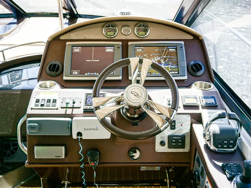 Slide: The Image of Helm of 2015 Regal 42 Sport Coupe with Garmin navigation system. - 9