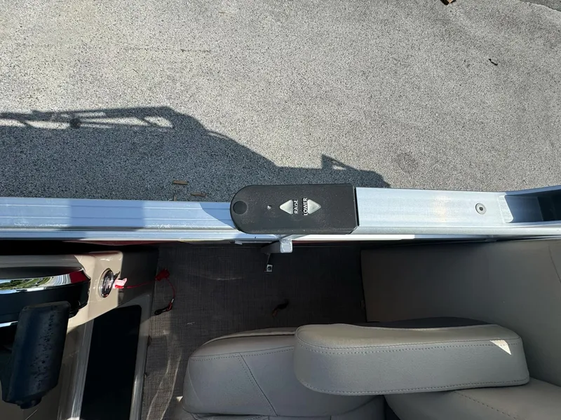 Slide: The Image of 2023 Sun Tracker Party Barge 24 DLX interior with seating and control panel. - 6