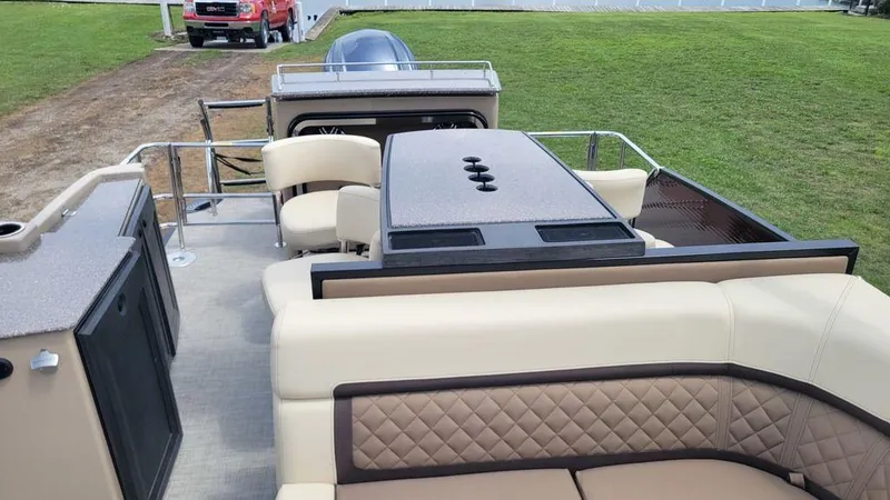 Slide: The Image of 2023 AquaPatio 275 CBE iMPACT pontoon boat with luxurious seating and modern design. - 15