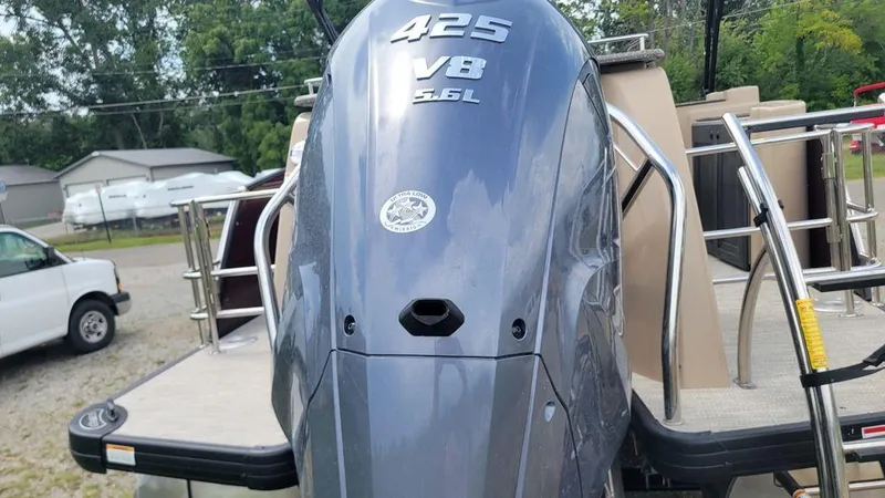 Slide: The Image of 2023 AquaPatio 275 CBE iMPACT boat with powerful 425 V8 engine, rear view. - 16