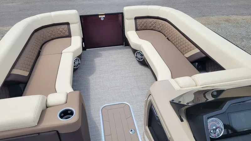 Slide: The Image of 2023 AquaPatio 275 CBE iMPACT boat interior with luxurious seating and modern design. - 4