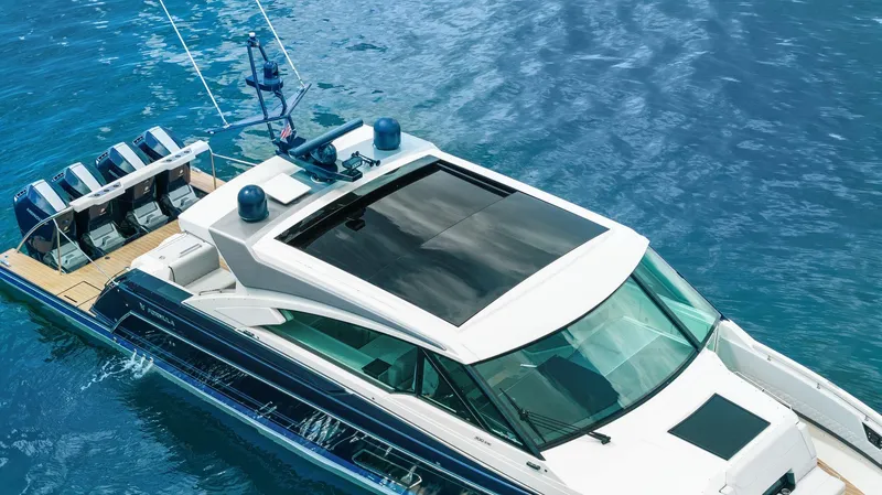 Slide: The Image of 2022 Formula 500 Super Sport Crossover yacht on clear blue water. - 10