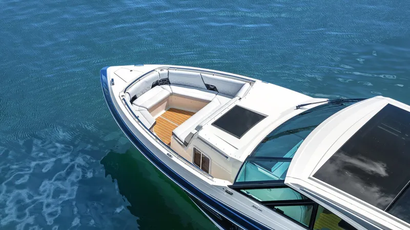 Slide: The Image of 2022 Formula 500 Super Sport Crossover boat on clear blue water. - 13