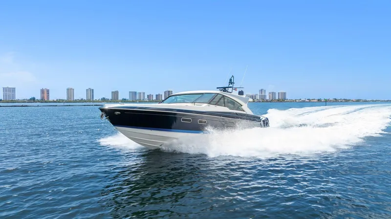 Slide: The Image of 2022 Formula 500 Super Sport Crossover cruising on open water, city skyline in background. - 16