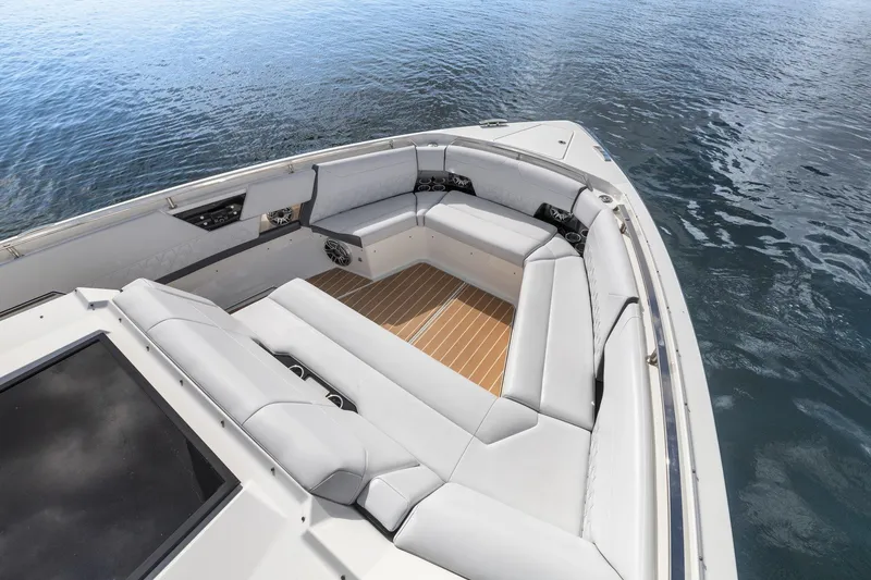 Slide: The Image of 2022 Formula 500 Super Sport Crossover boat with luxurious seating on calm water. - 24
