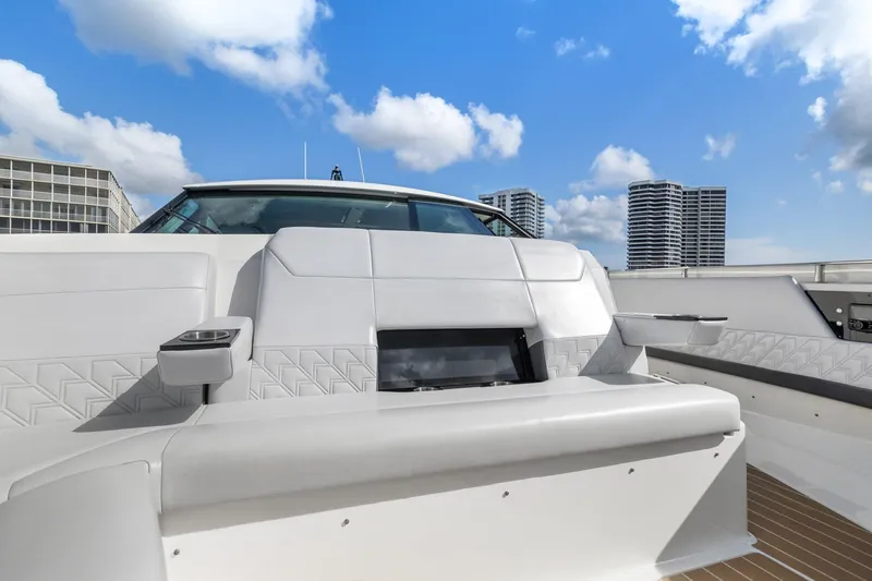 Slide: The Image of 2022 Formula 500 Super Sport Crossover boat with luxurious seating, city skyline background. - 29