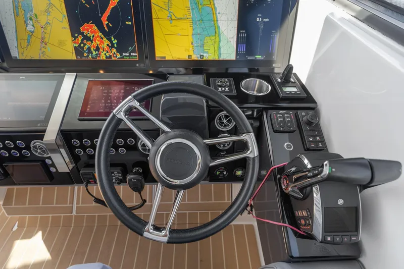 Slide: The Image of 2022 Formula 500 Super Sport Crossover helm with advanced navigation displays and controls. - 39