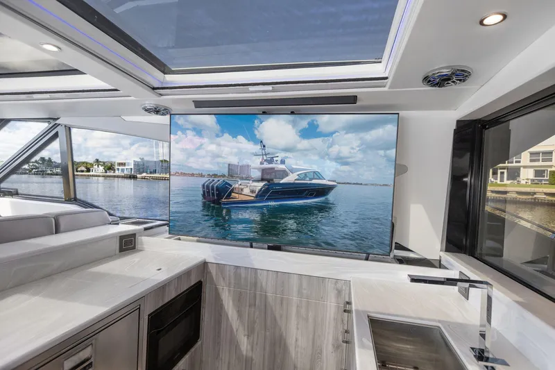Slide: The Image of Interior view of 2022 Formula 500 Super Sport Crossover yacht with large screen display. - 45