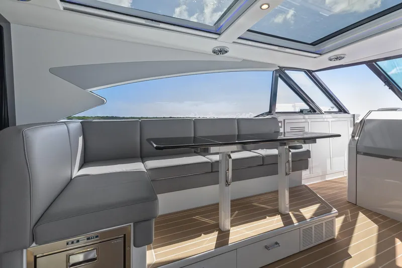 Slide: The Image of Luxurious interior of 2022 Formula 500 Super Sport Crossover yacht with sleek seating and panoramic windows. - 48