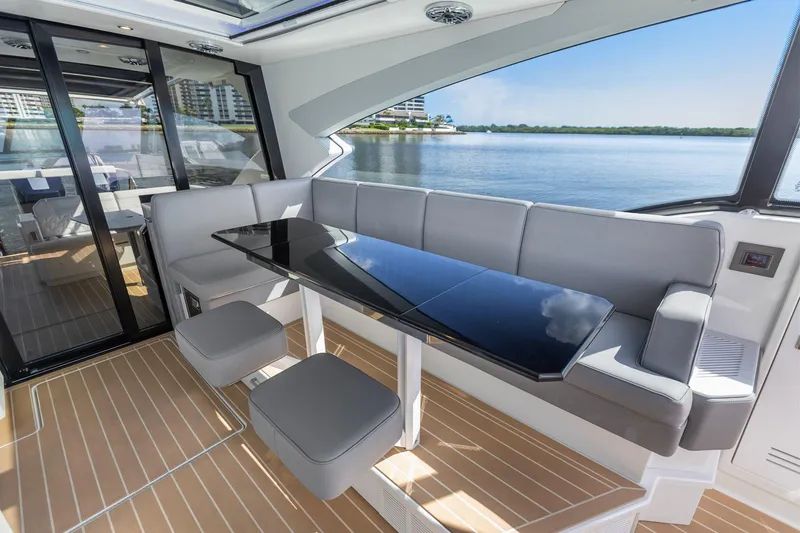 Slide: The Image of Luxurious interior of 2022 Formula 500 Super Sport Crossover yacht with sleek seating and table. - 49