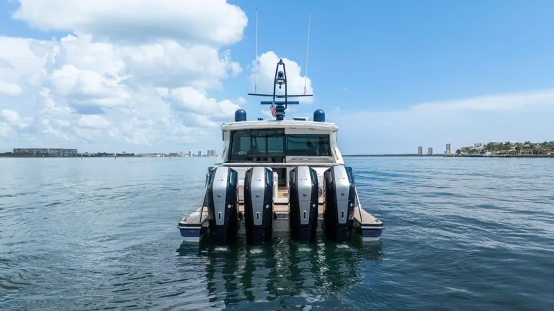 Slide: The Image of 2022 Formula 500 Super Sport Crossover boat on calm water, rear view. - 5